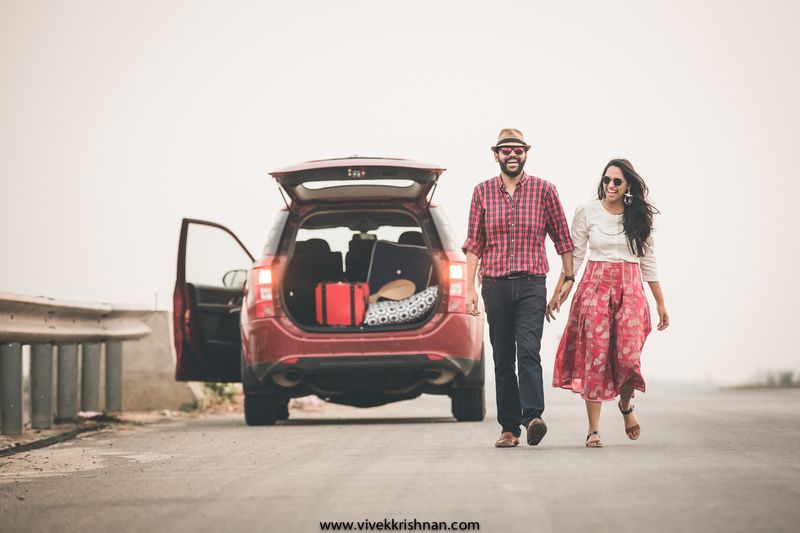 Impassioned couple posing on luxurious car Stock Photo by ©DariYad 111223156