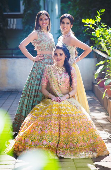 Sister of the Bride - Bride in a Red Bridal Lehenga and Sisters in a Pink  Lehenga wi… | Indian wedding photography poses, Wedding photoshoot poses,  Bride photoshoot