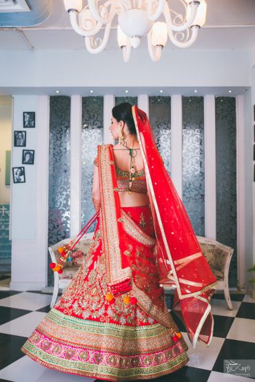 Red bridal lehenga with orange blouse