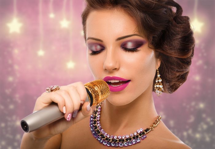 Singing Woman with Microphone. Beauty Glamour Singer Girl