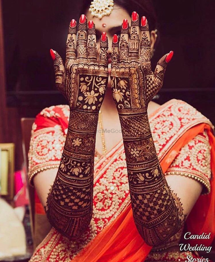 layered mehendi designs on hand