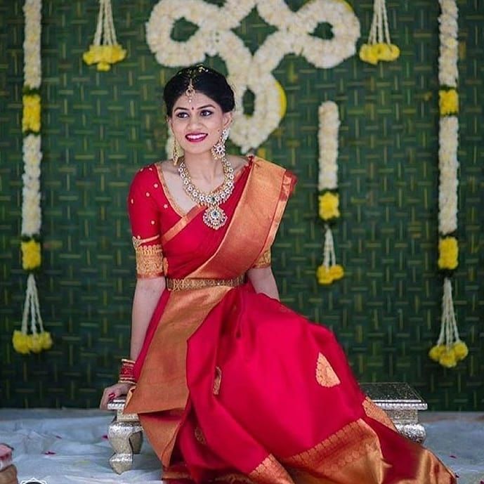 Bridal red kanjivarams saree with jewel tones