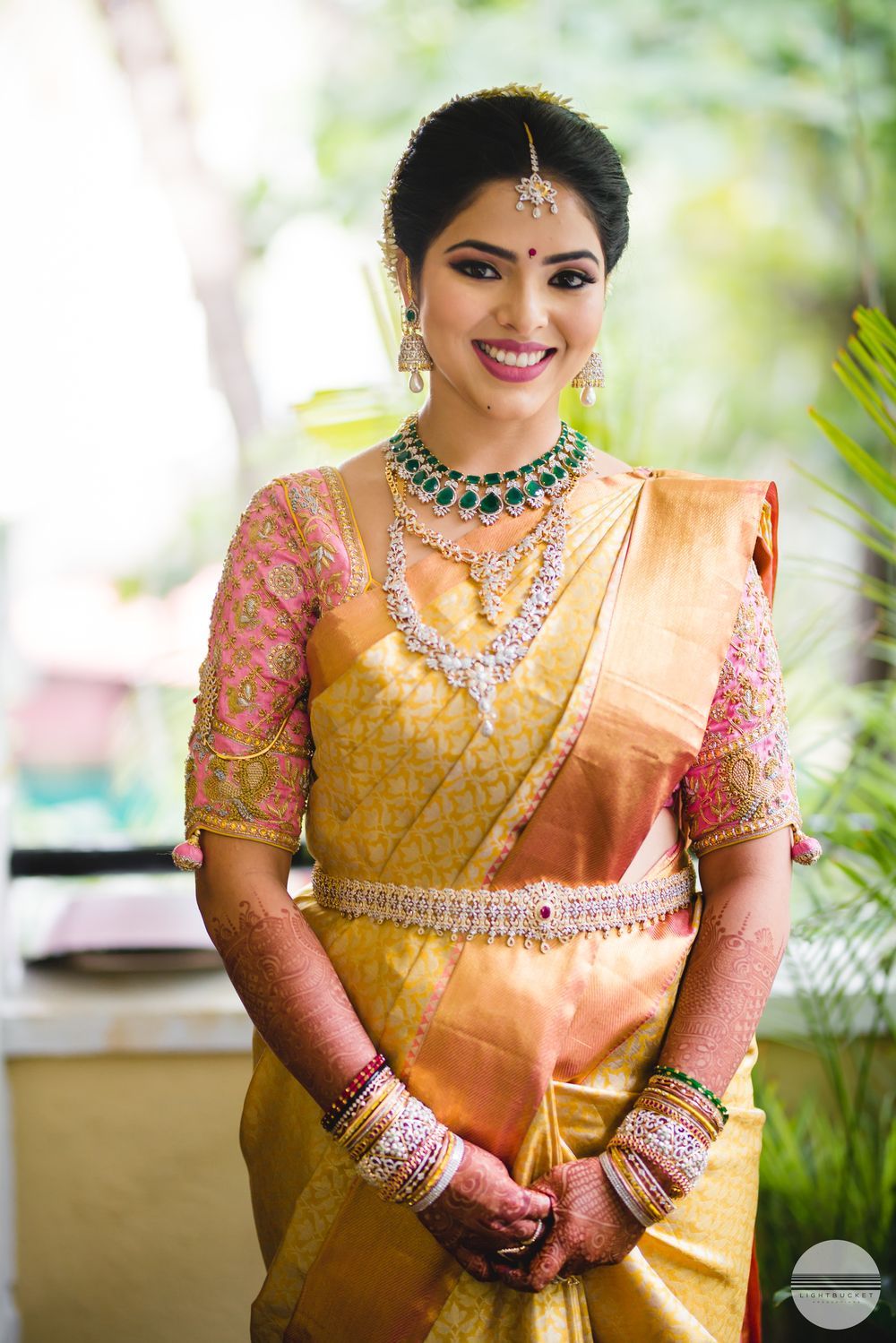 Gold kanjeevaram saree with light pink blouse