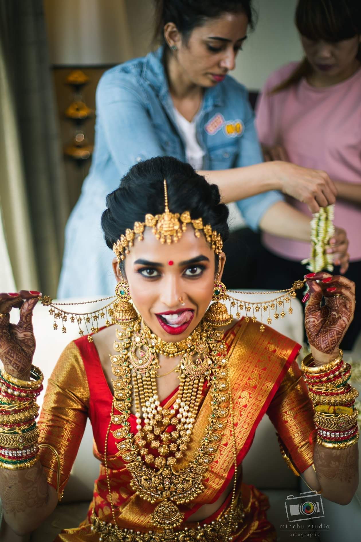 Bridal red kanjeevaram saree with jewel tones