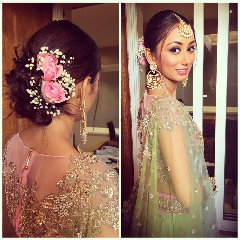 Engagement bun hairstyle with flowers