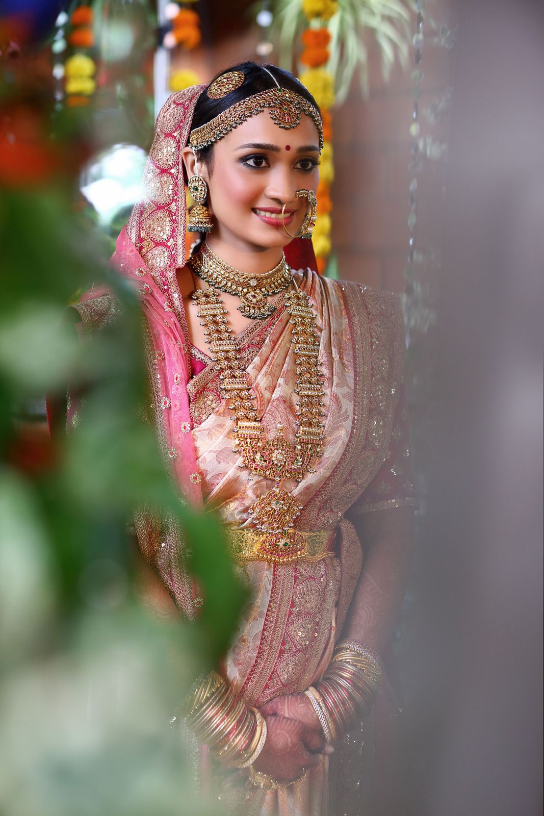Pink bridal kanjeevaram with heavily embroidered veil
