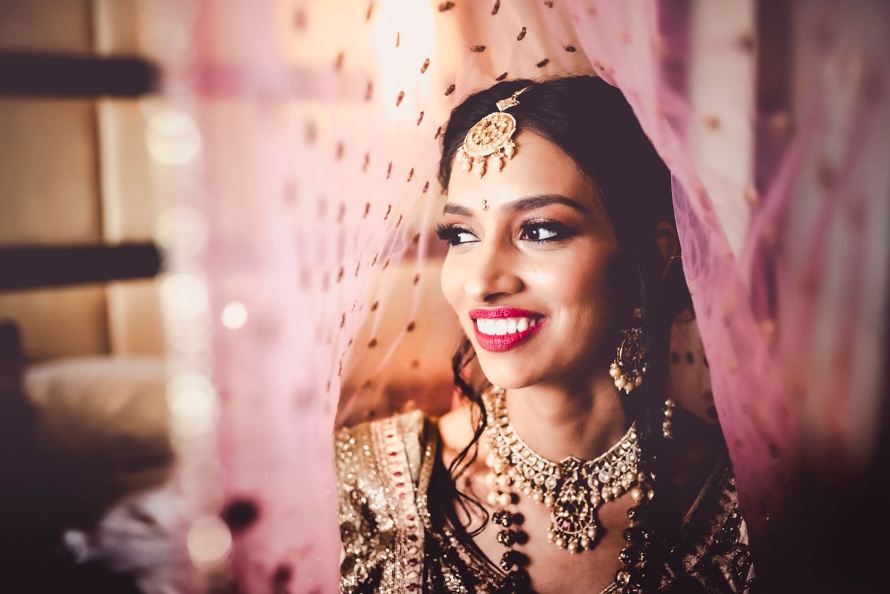 An Intimate Wedding With The Bride In A Glimmering Gold Lehenga | WedMeGood