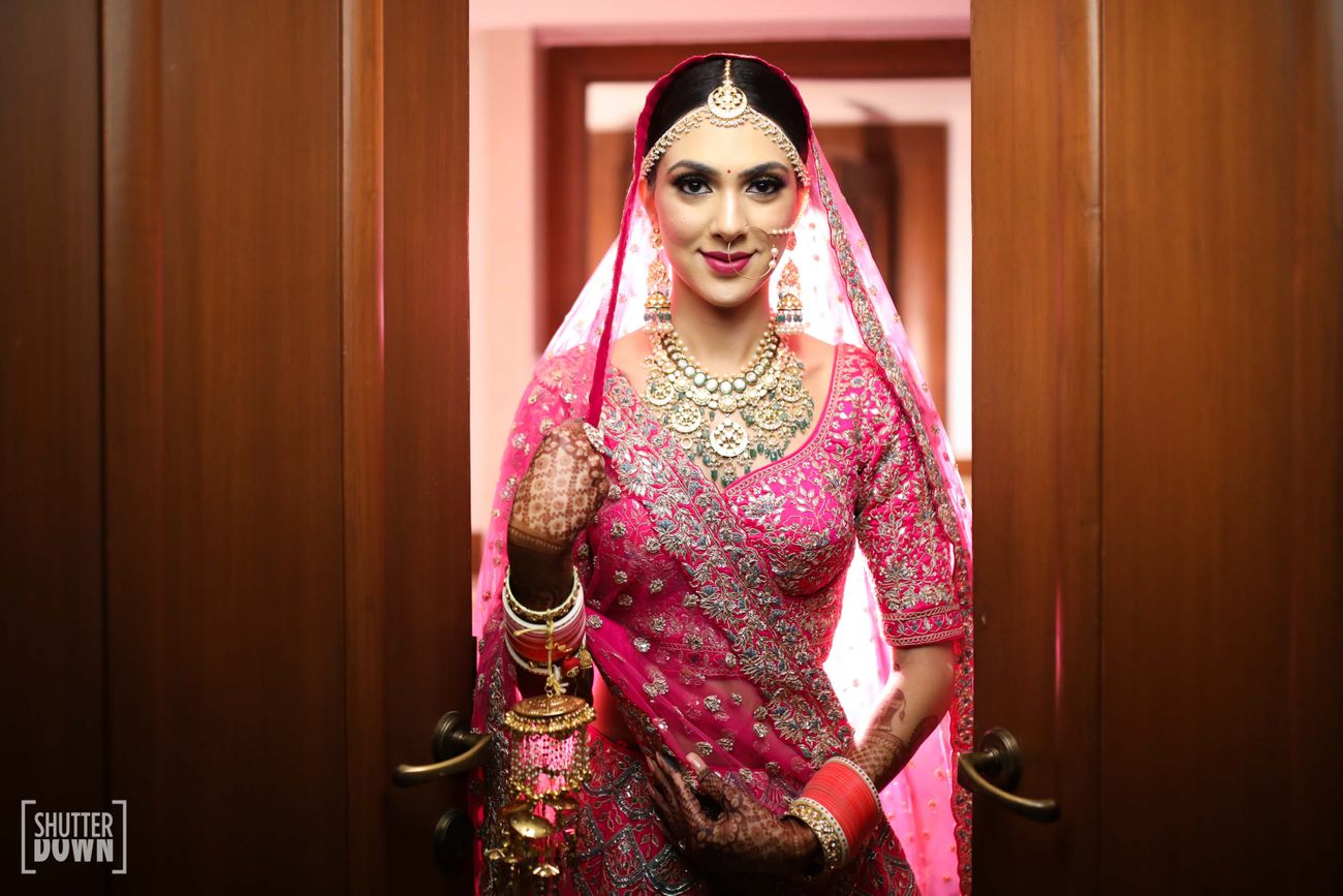 Elegant Delhi Wedding With A Refreshing Mehendi Look | WedMeGood