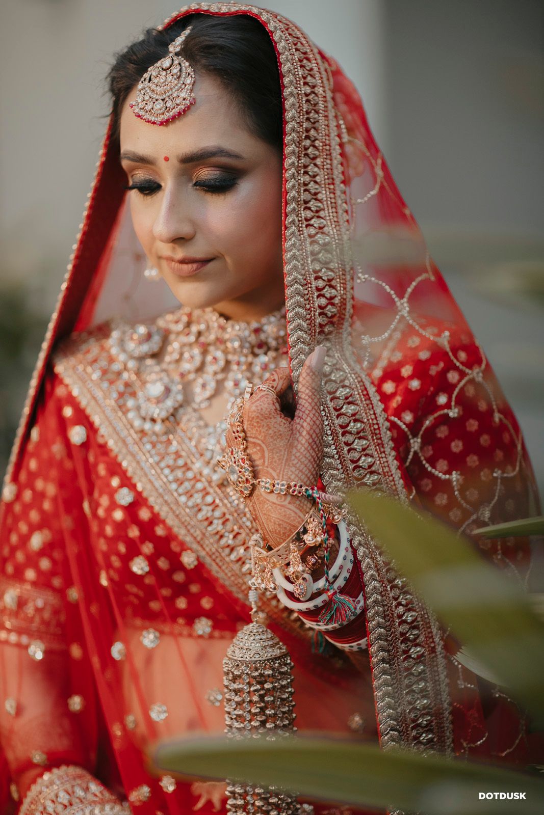 bride in a red lehenga