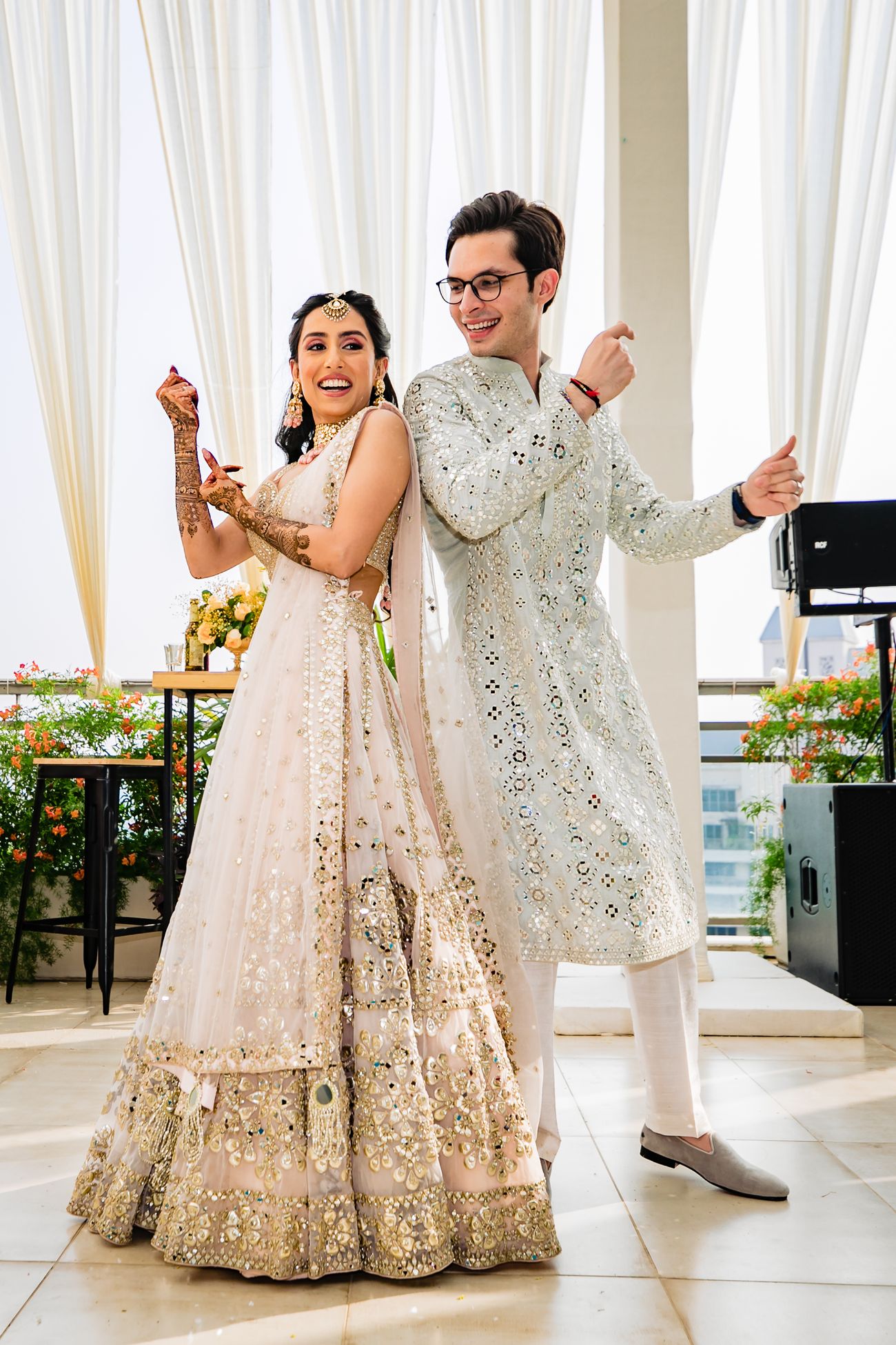 bride and groom dancing on sangeet