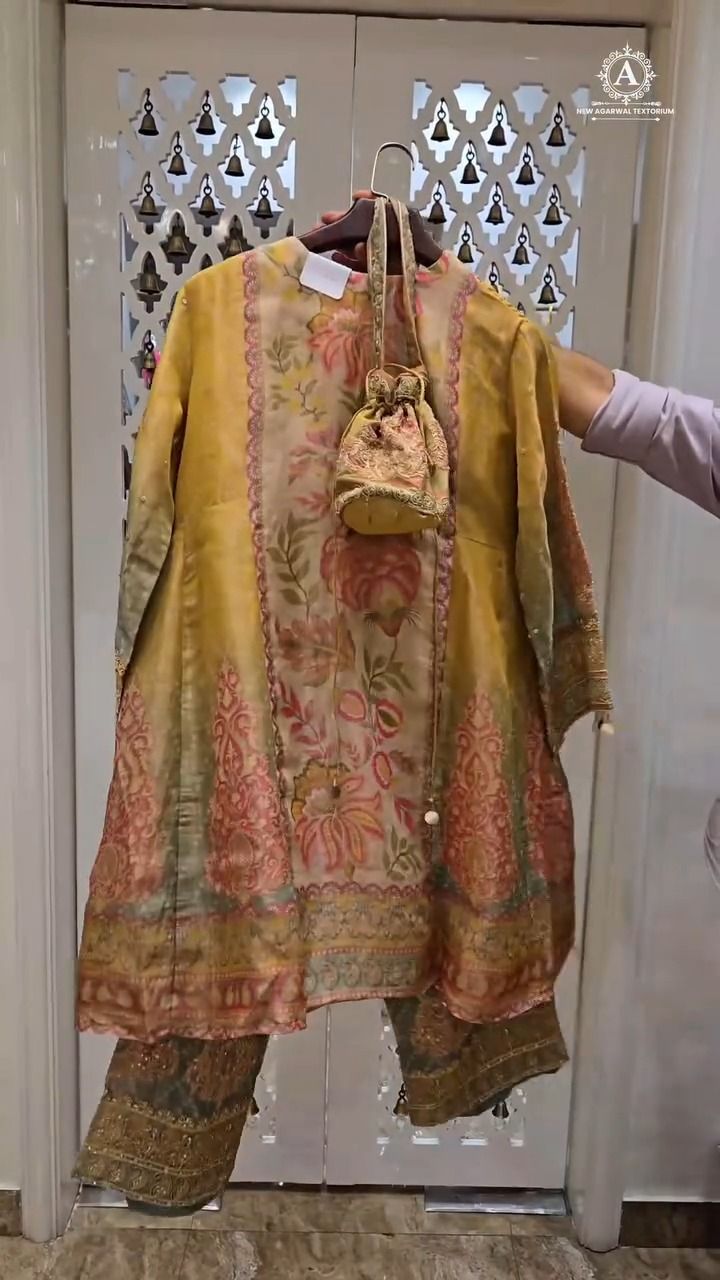 Embroidered festive suit with matching potli bag