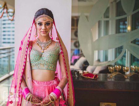 Pretty Delhi Wedding With A Bright Pink Bride And An Elegant Mehendi!