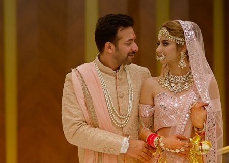 A Dubai Wedding With The Bride In A Pastel Pink Lehenga With An Off Shoulder Blouse