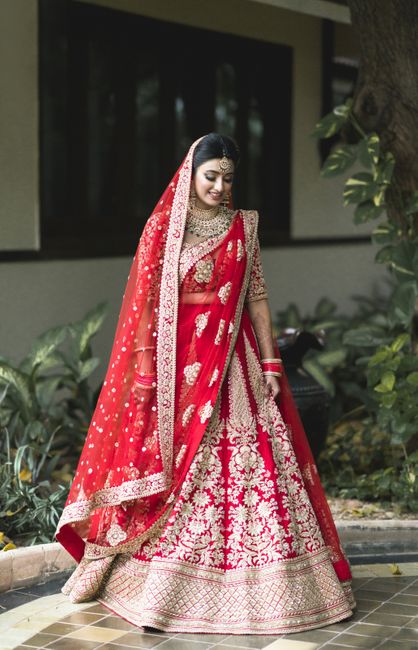 An Elegant Wedding With The Bride In A Ravishing Red Lehenga