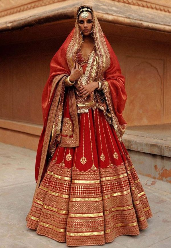 Mouni Roy wore a red Sabyasachi lehenga for her wedding | VOGUE India