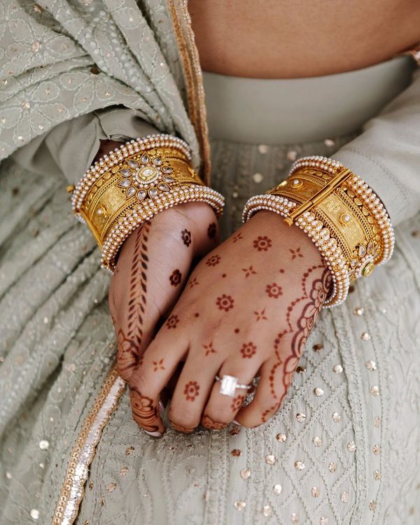 Beautiful woman dressed up as Indian tradition with henna mehndi design on  her both hands to celebrate big festival of Karwa Chauth, Karwa Chauth  celebrations by Indian woman for her husband Stock