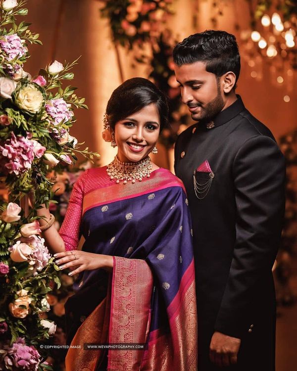 cultural real wedding Indian weddings Chicago IL black red bride groom  attire for reception