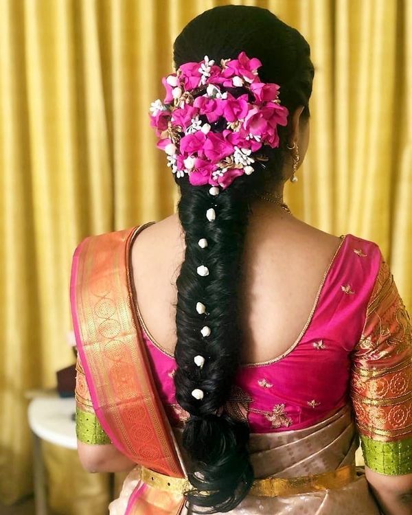 Indian village girls traditional hair style with plait and flowers. Andhra  Pradesh, India Stock Photo - Alamy