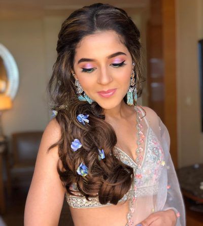 Why Flowers In Open Hair Are The Best Way To Add A Touch Of Glam