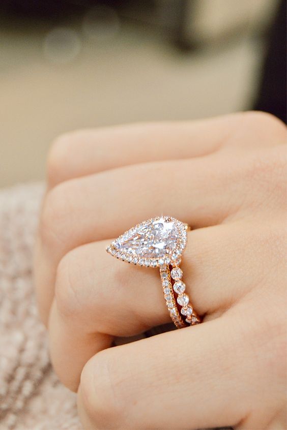Unique rose gold ring with uplifted design and 2ct solitaire -