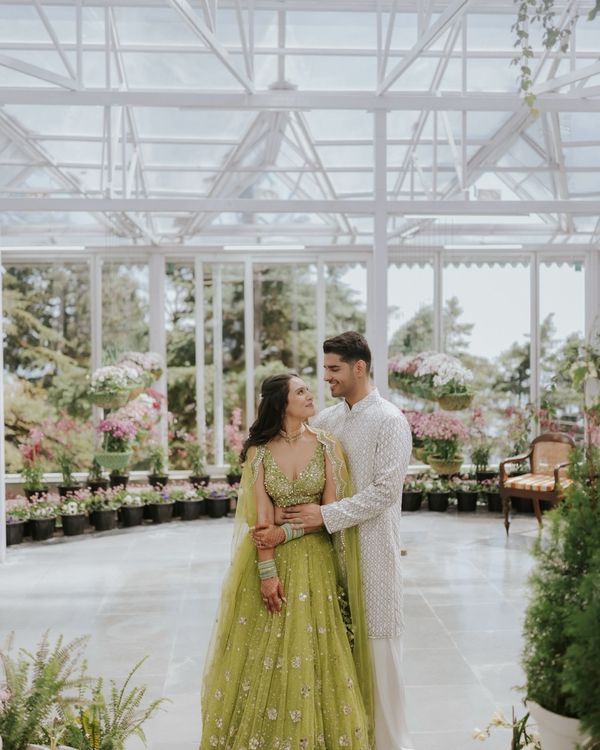 Greenhouse-inspired wedding setting with lush foliage