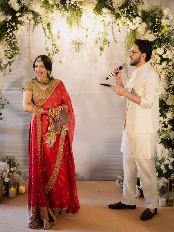 Intimate Mumbai home wedding with a classic red bridal saree