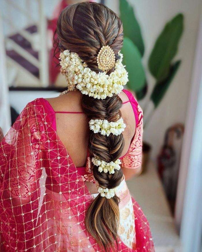 Gorgeous romantic bridal hairstyle by MUA Vejetha Anand for Swank. Braids  with f… | Indian wedding hairstyles, Engagement hairstyles, Braided  hairstyles for wedding