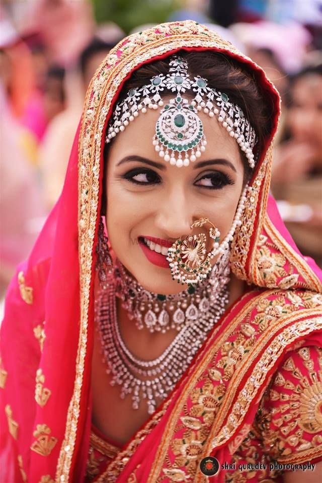 Bridal lehenga and makeup. Maroon colour lehenga choli with kundan jewellery.  Royal wedding look. | Quick, Save
