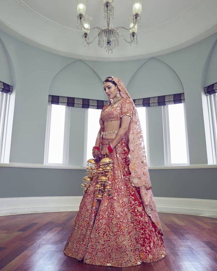 20+ real brides who stunned us in their Anamika Khanna lehengas | Anamika  khanna, Red lehenga, Indian wedding dress
