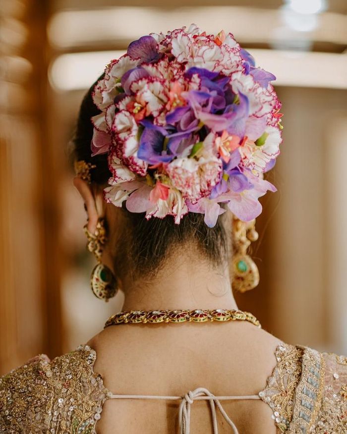 Add Vividness To Your Intimate Wedding With These Colorful Floral Buns |  WedMeGood