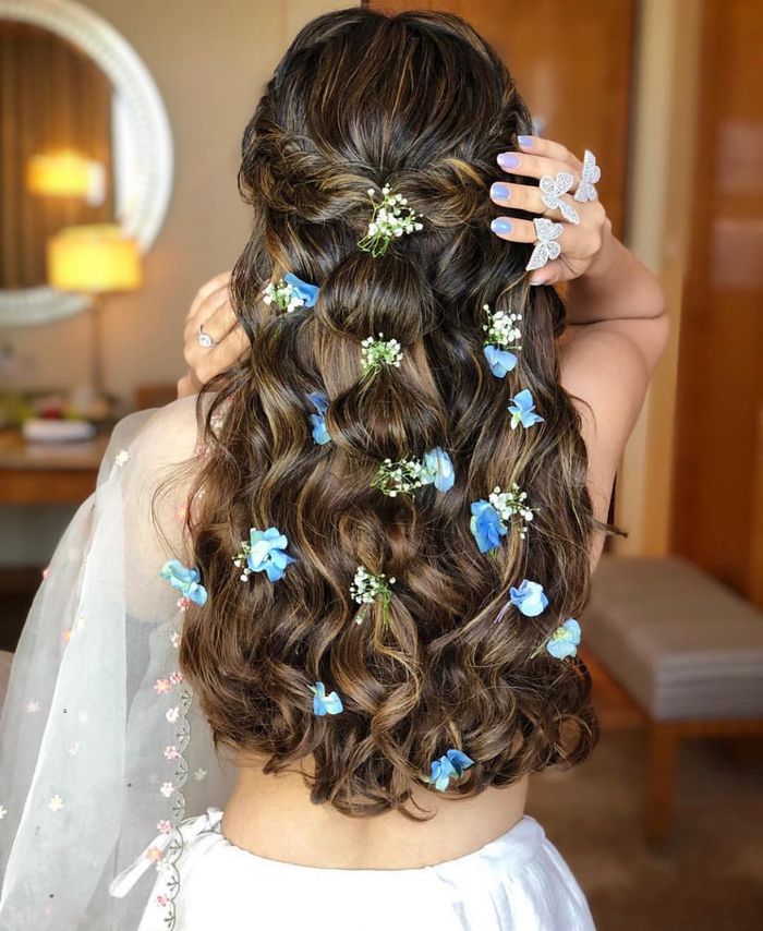 Indian Wedding Bun Hairstyle With Flowers and Gajra
