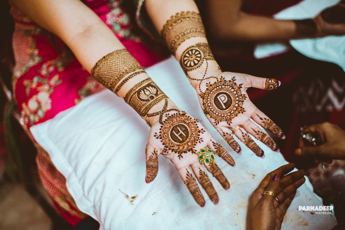 Photo of Bride and Groom portrait minimalistic mehndi design.