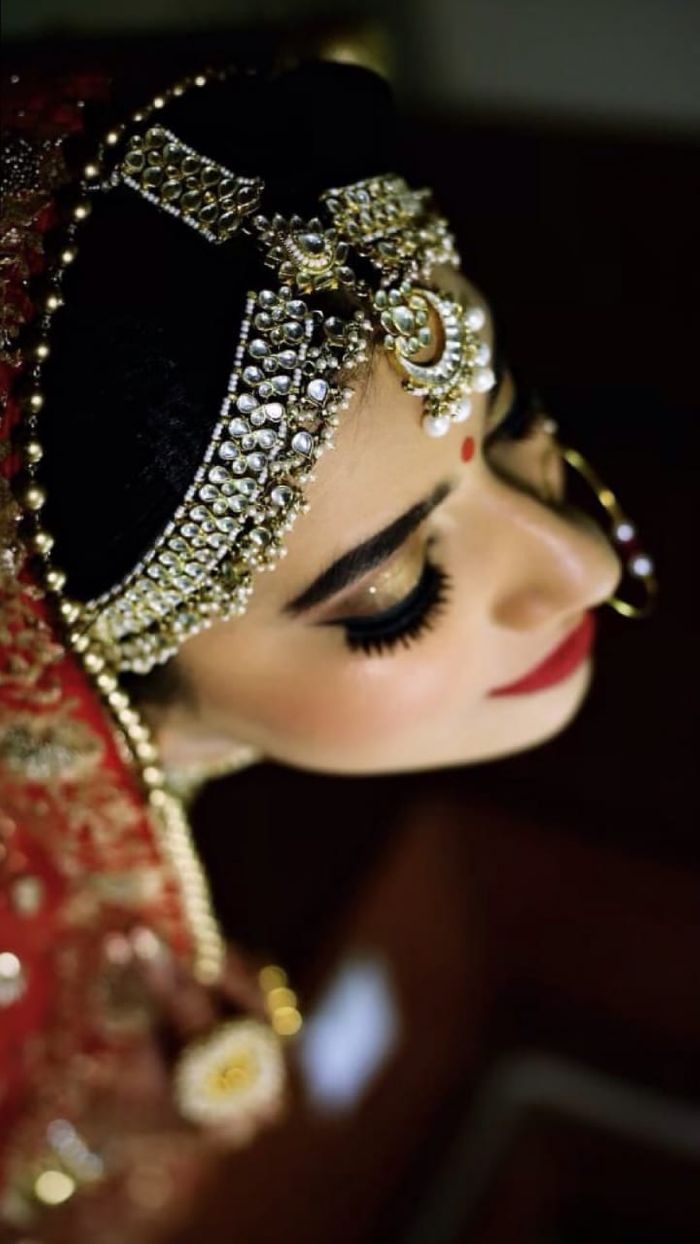 Indian bride in white and golden lehenga with smokey eyes for wedding. See  more on wedmegood.com #wedm… | Indian bride makeup, Bride makeup eyes, Bridal  eye makeup