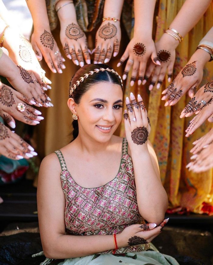 An Indian woman applies a Mehndi design to a girls hand with a henna cone  Nov 17 2018 at the Mobile International Festival in Mobile Alabama  Stock Photo  Alamy