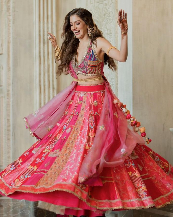 IVORY WHITE MULTI COLOURED SEQUIN PATTERNED LEHENGA SET WITH A HAND  EMBROIDERED BLOUSE PAIRED WITH A CONTRAST PINK DUPATTA AND COLOURED  DETAILS. - Seasons India