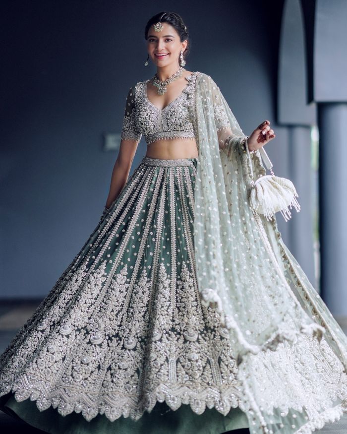 An Elegant Goa Wedding With Cherry Blossoms And The Bride In A Silver Grey  & Red Lehenga | Combination dresses, Lehenga color combinations, Bridal  dress fashion