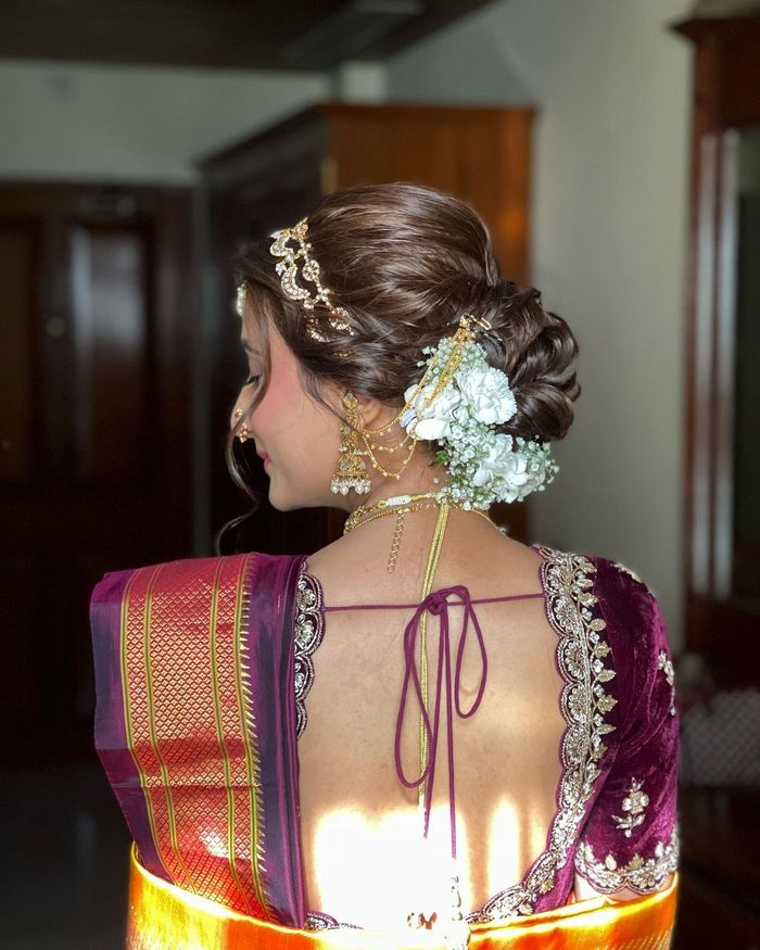The close-up shot of Indian Maharashtrian bride with beautiful hair style  decorated with flowers Stock Photo - Alamy