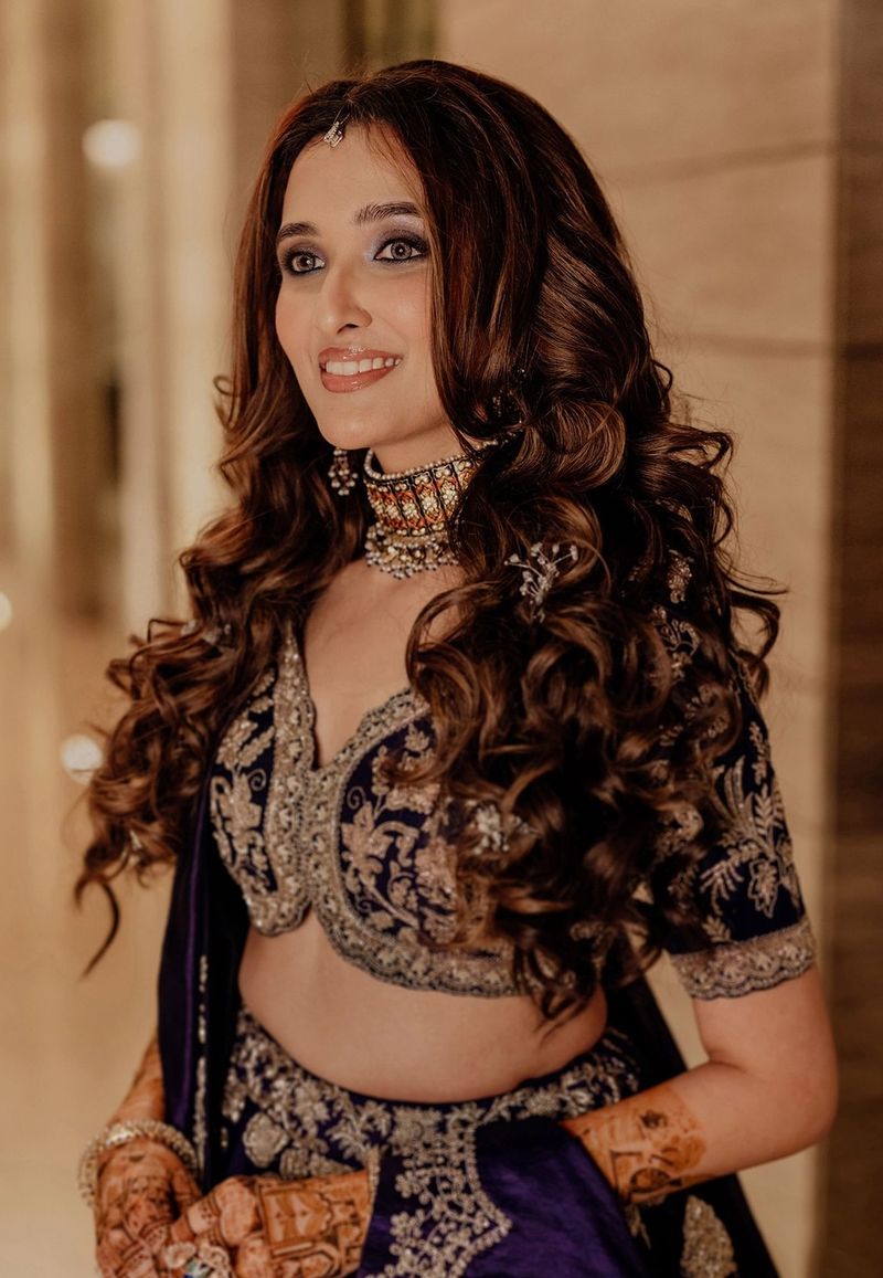Long curls worn loose for a reception