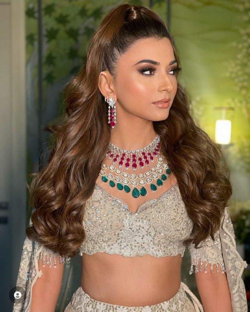 High half ponytail with textured waves