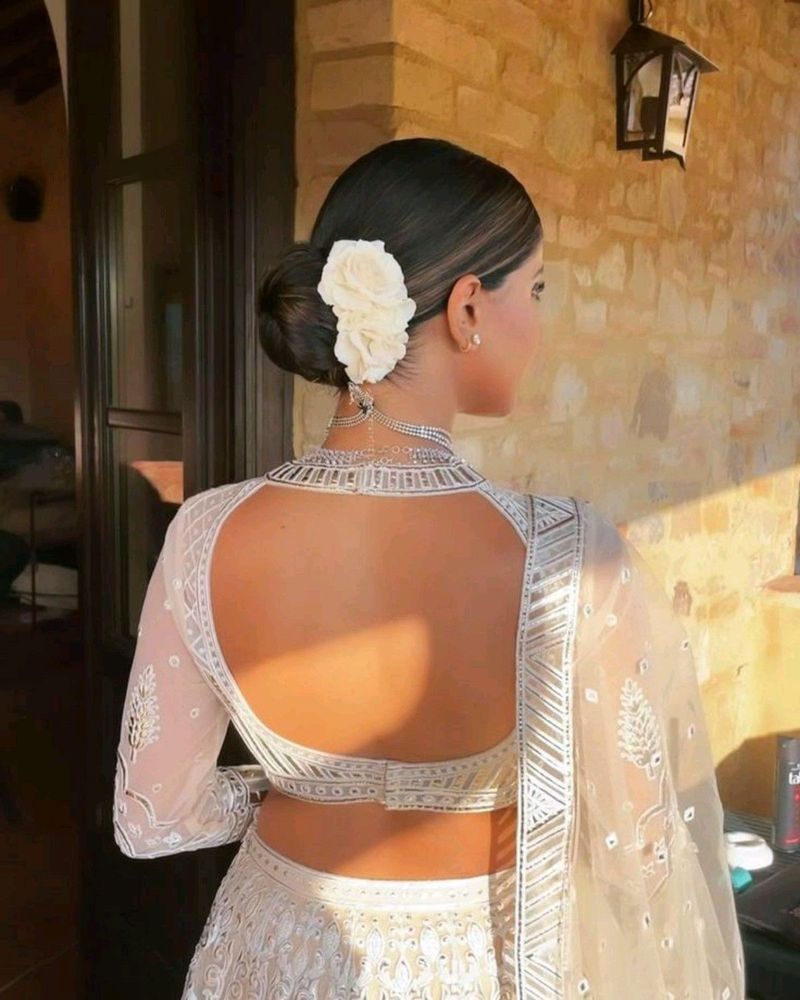 Sleek bun that converts from wedding ceremony to reception