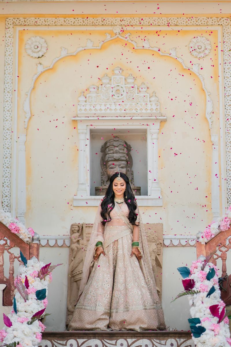 Bride walking down a staircase as her wedding entry