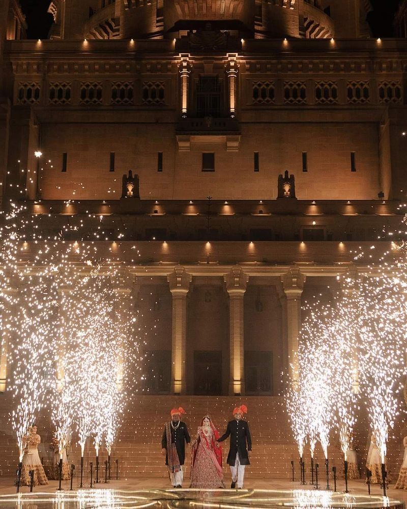 Guests forming a tunnel of sparklers for the bridal entry