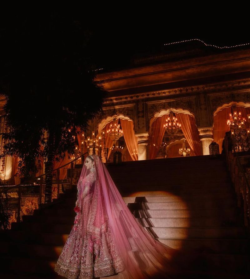 Bride walking in under a single spotlight