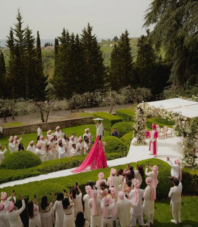 Bridal entry moment photographed from the front of the aisle