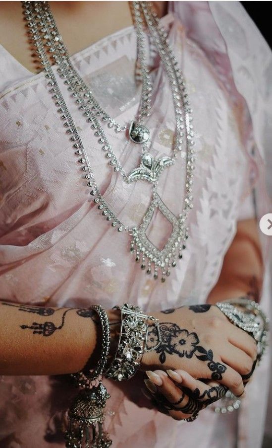 Chunky silver necklace with temple-inspired motifs