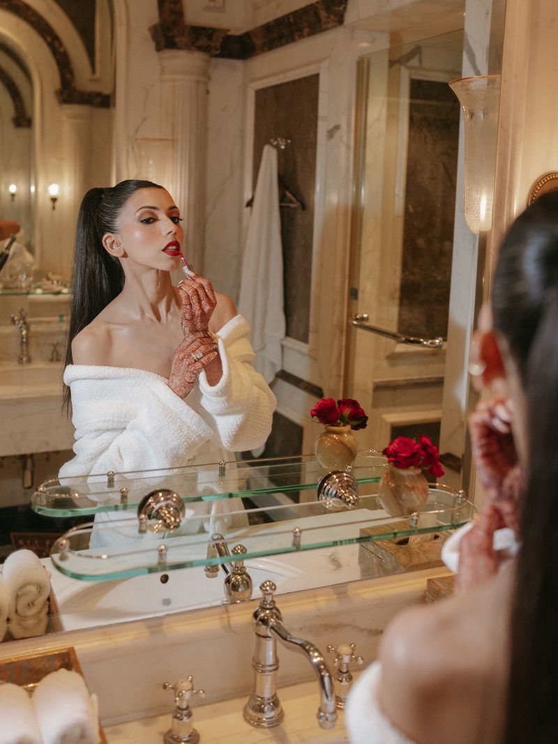Sleek high ponytail reception hairstyle with a centre part