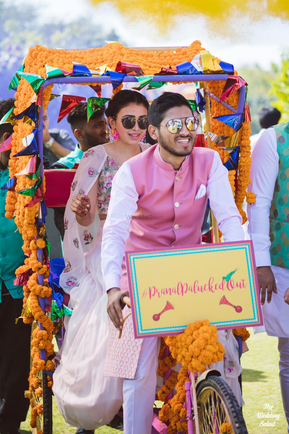 Photo of bride and groom entering together on mehendi in decorated rickshaw