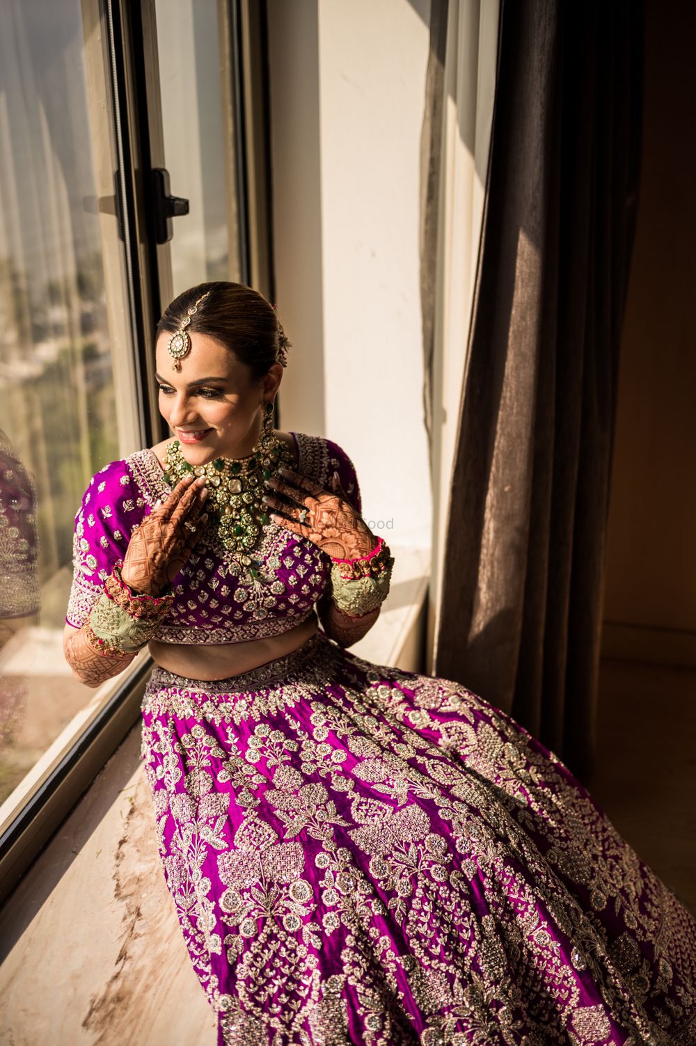 Photo of Bridal portrait wearing purple anita dongre lehenga