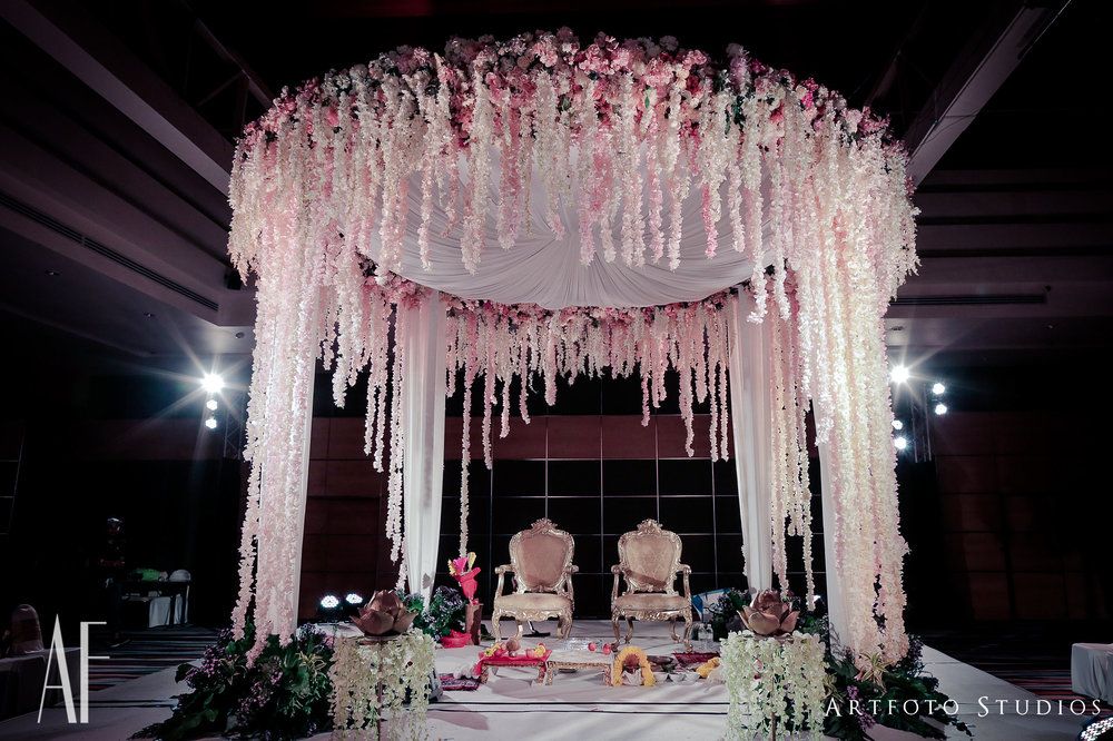 Photo of Pretty indoor mandap with pastel decor