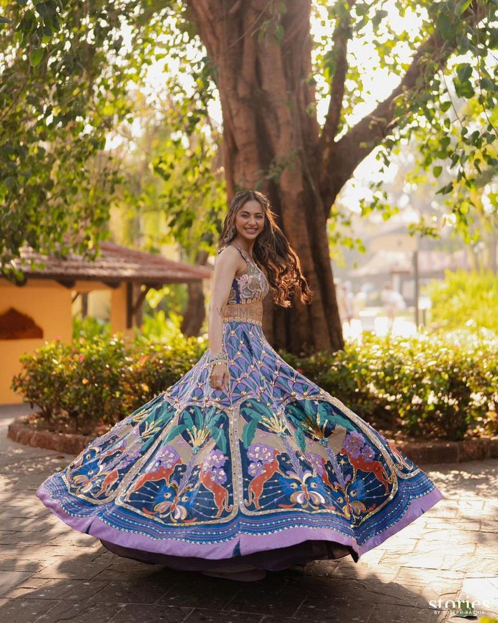 Photo of Celebrity bride on her haldi day twirling away in a blue lehenga